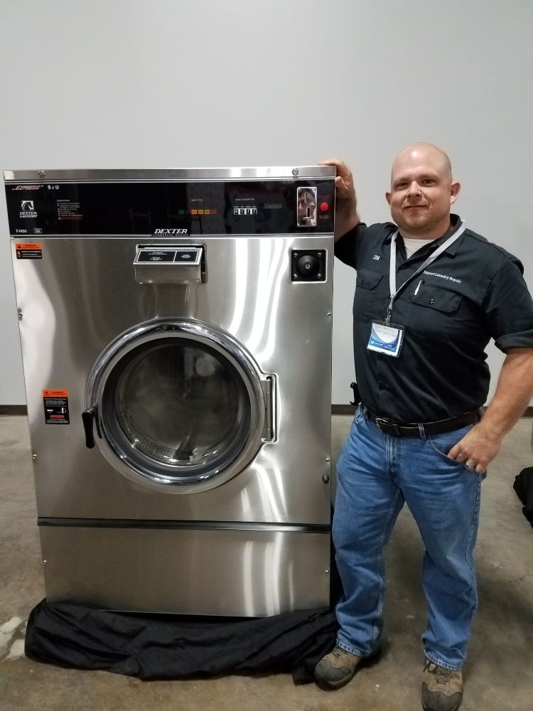 Laundry appliance repair technician at work